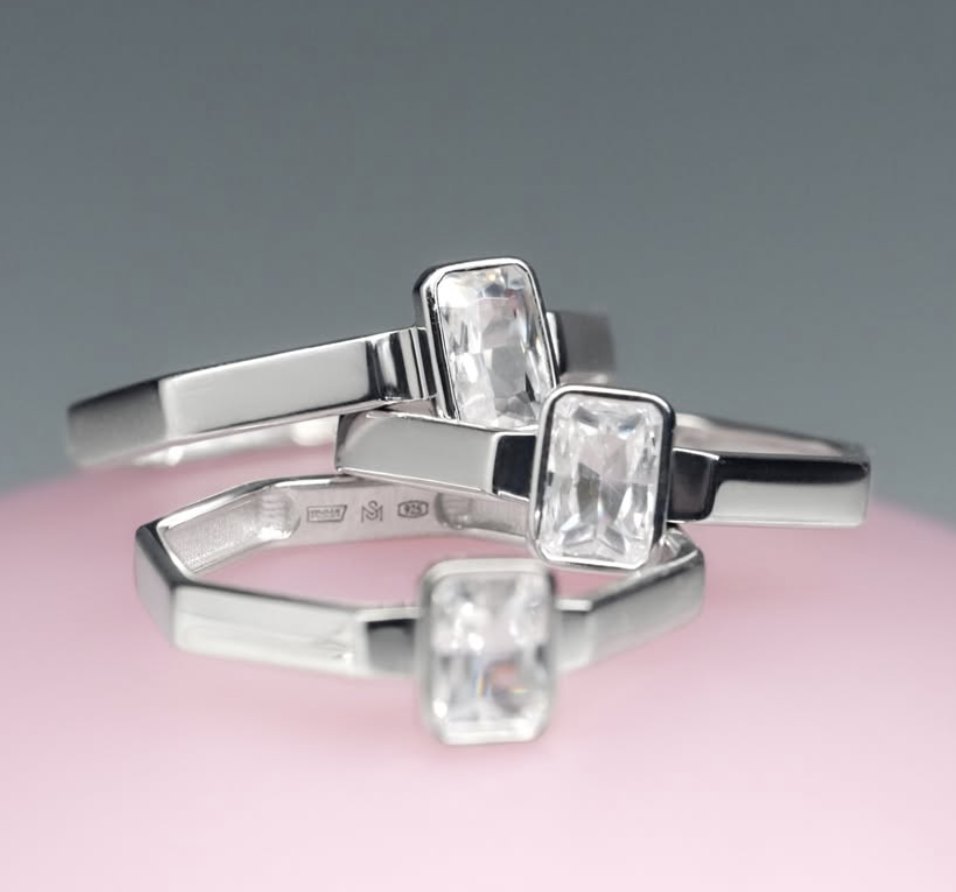 Stackable rings with emerald-cut clear stones